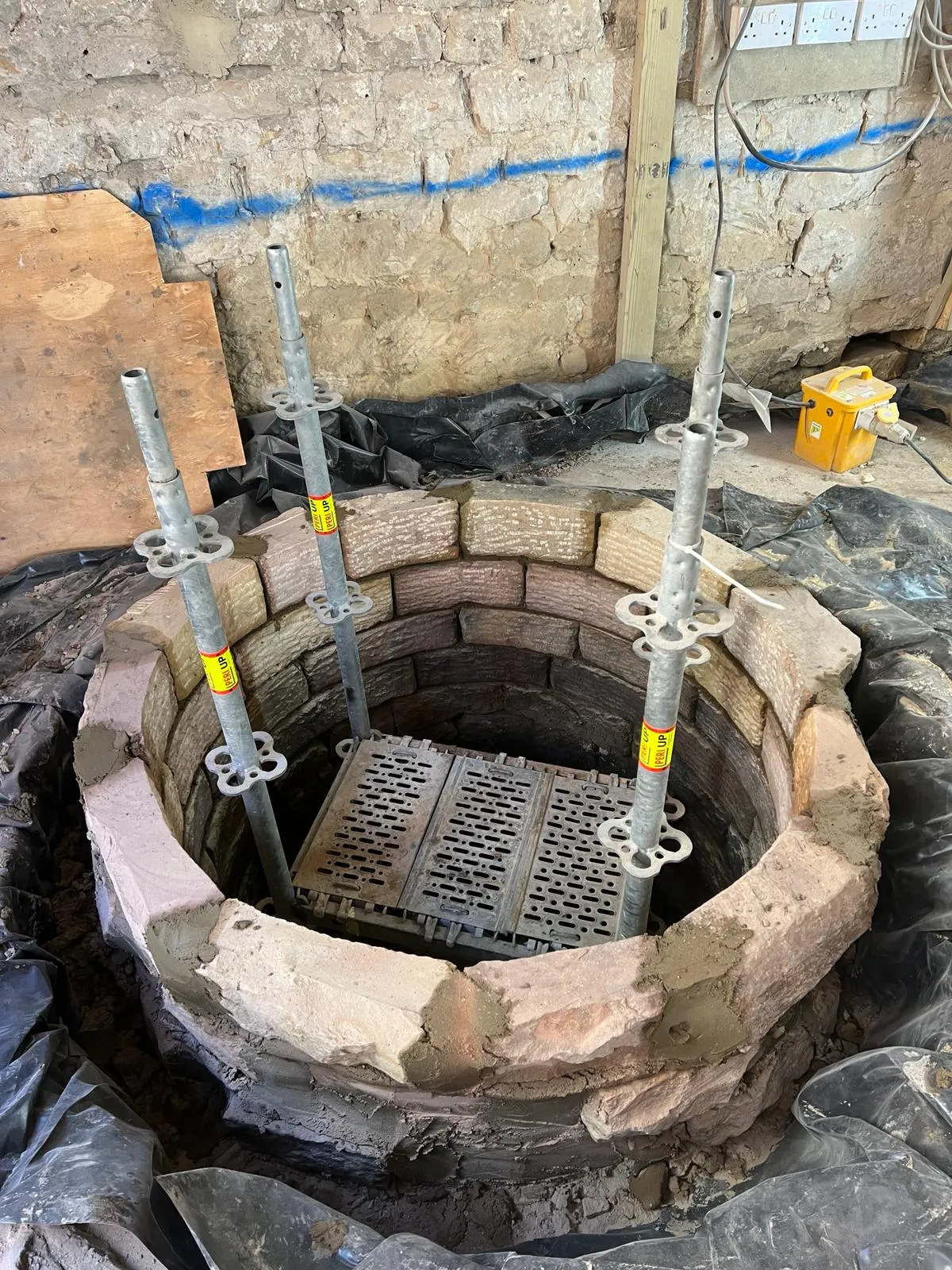 A hole in the ground that is being built.