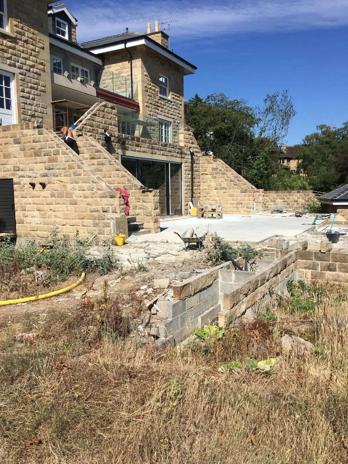 A brick building with a fire hydrant in front of it.